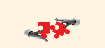 Two hands connecting or detaching two puzzle pieces